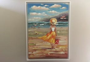 Girl on a Summer Beach with a Red Bucket